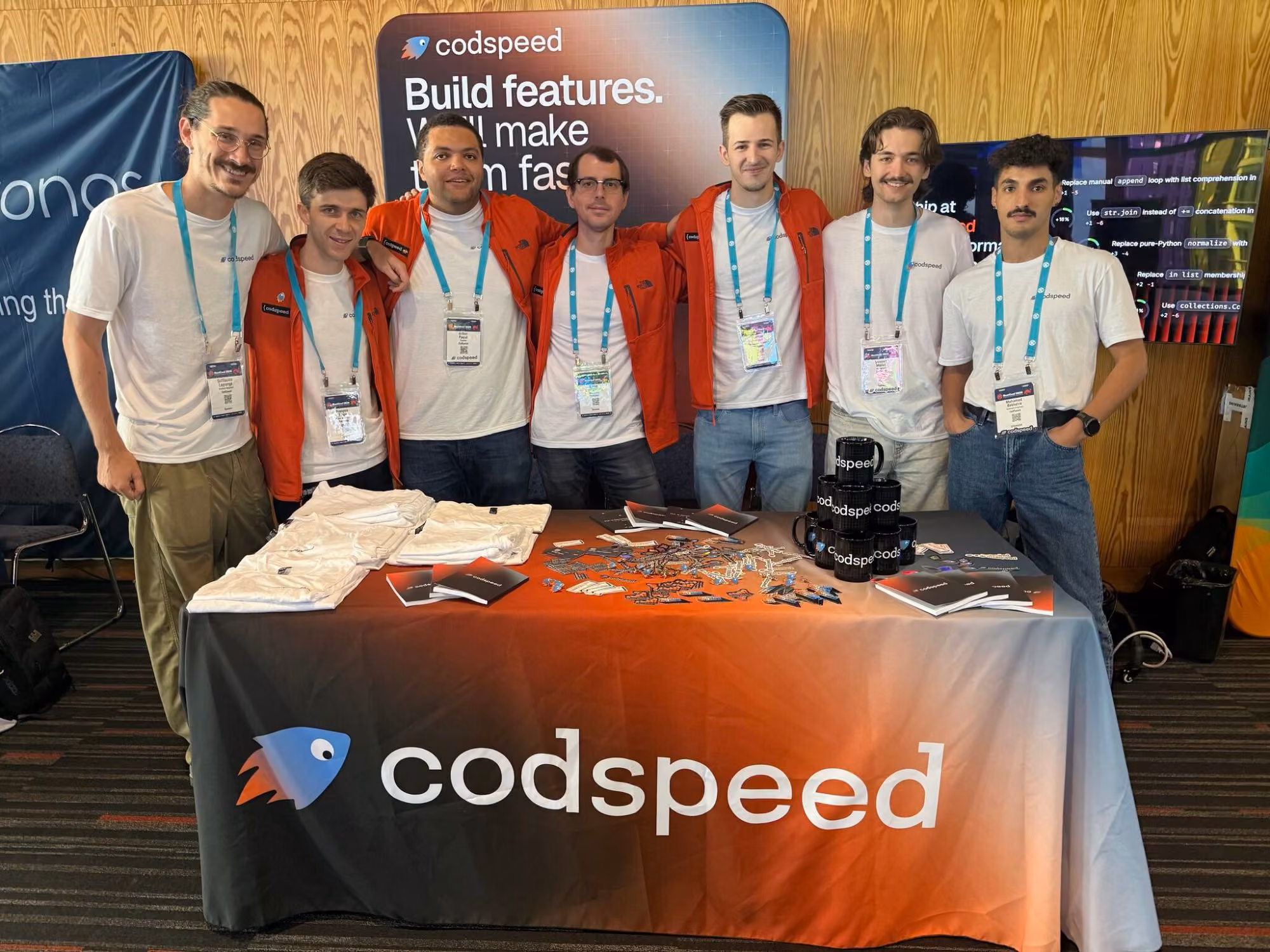 The CodSpeed team at a conference booth